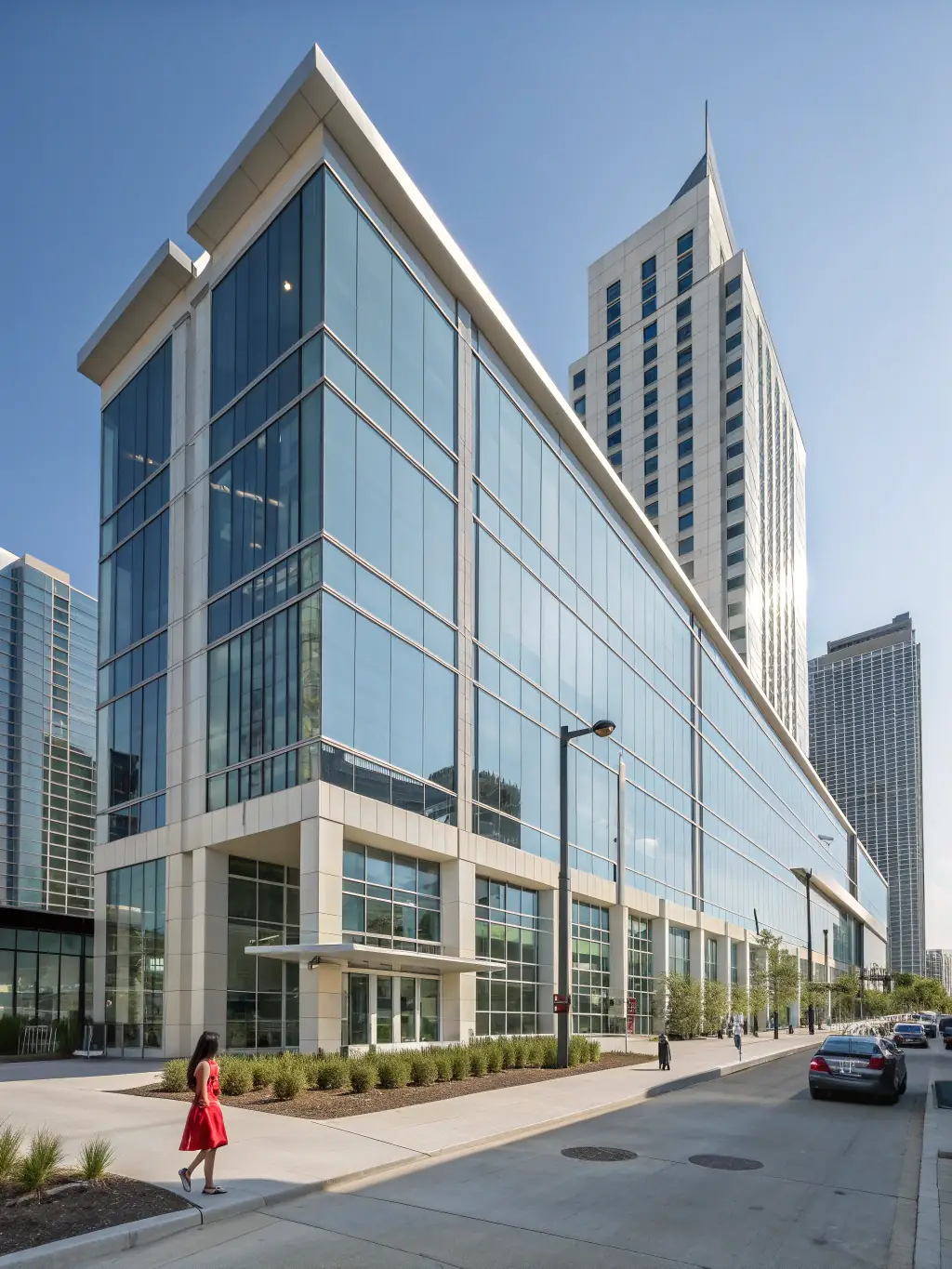 A contemporary commercial building with expansive glass facades, clean lines, and an inviting entrance, illustrating FacadeStory.com's commercial construction capabilities.